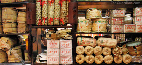 Various compressed pu'er products in a small shop