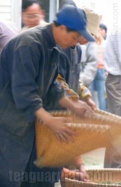 Farmers sieving tea in a tea farmer's market