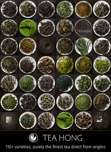 Rows and columns of small white dishes each holding a variety of tealeaves in different colours and shapes